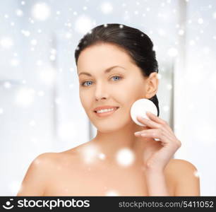 health and beauty concept - beautiful woman with cotton pad