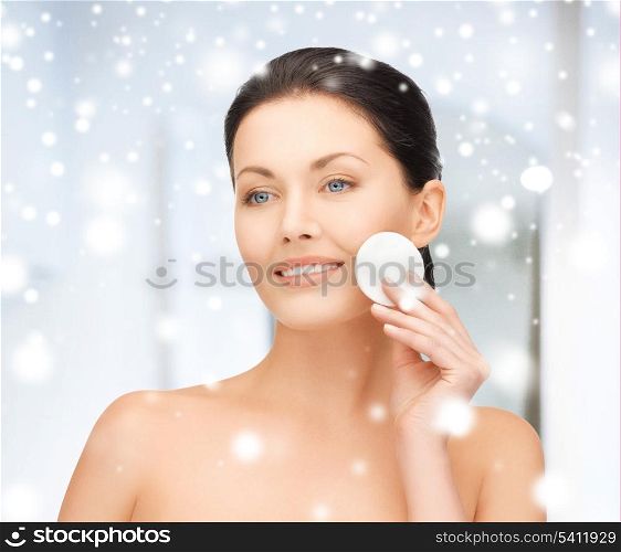 health and beauty concept - beautiful woman with cotton pad