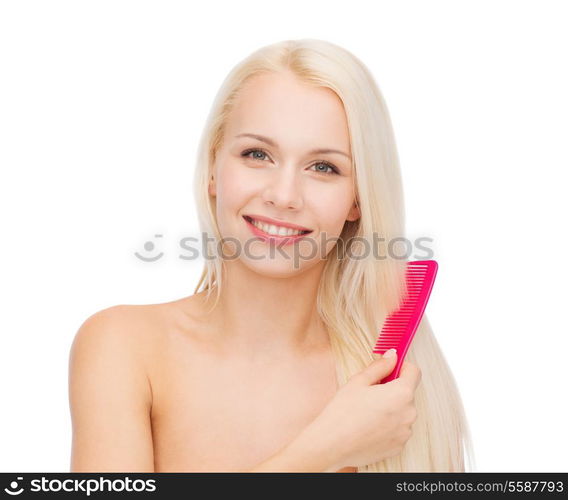 health and beauty concept - beautiful woman with long hair and brush