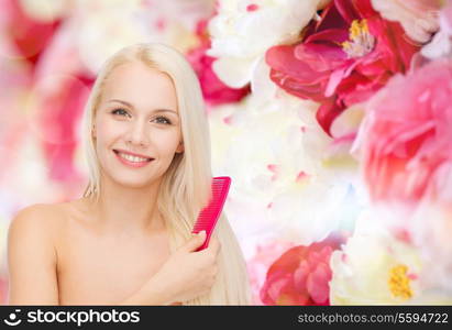 health and beauty concept - beautiful woman with long hair and brush