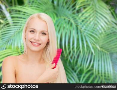 health and beauty concept - beautiful woman with long hair and brush