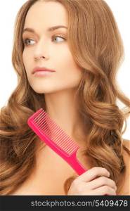 health and beauty concept - beautiful woman with long hair and pink brush