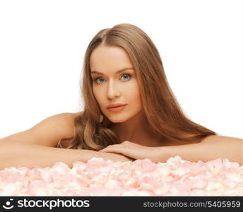 health and beauty concept - beautiful woman with rose petals