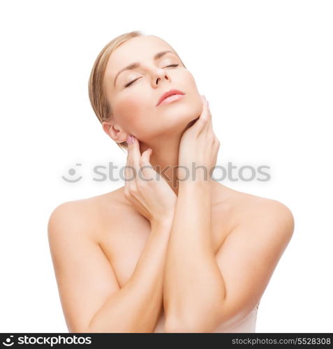health and beauty concept - beautiful young woman touching her face with closed eyes