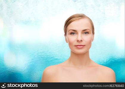 health and beauty concept - clean face of beautiful young woman