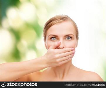 health and beauty concept - clean face of beautiful young woman covering her mouth with hand