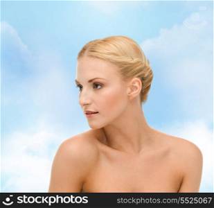 health and beauty concept - close up of clean face of beautiful young woman