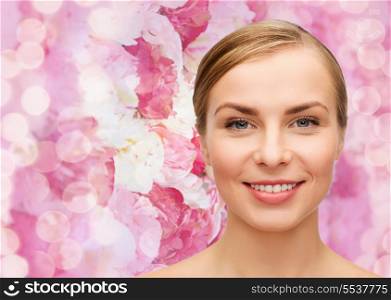health and beauty concept - closeup of face of beautiful young woman