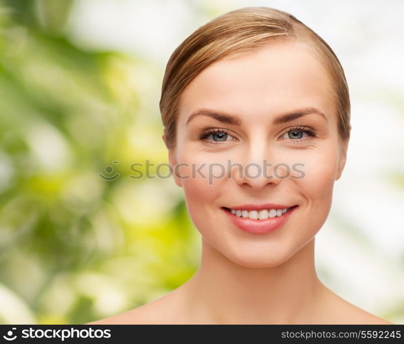 health and beauty concept - closeup of face of beautiful young woman