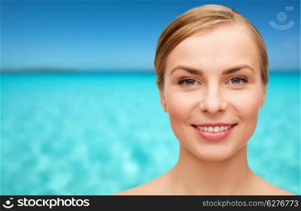 health and beauty concept - closeup of face of beautiful young woman
