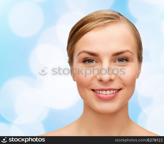 health and beauty concept - closeup of face of beautiful young woman