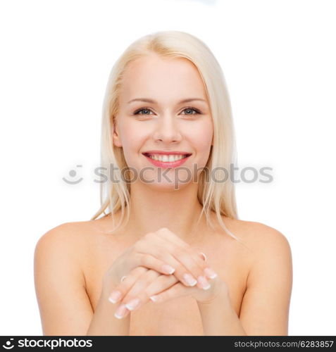 health and beauty concept - face and hands of beautiful woman