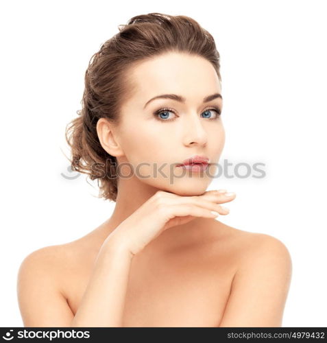 health and beauty concept - face and hands of beautiful woman with updo (can be used as a template for jewelry). beautiful woman with long hair