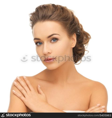 health and beauty concept - face and hands of beautiful woman with updo (can be used as a template for jewelry)