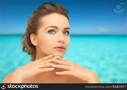 health and beauty concept - face and hands of beautiful woman with updo, can be used as a template for jewelry