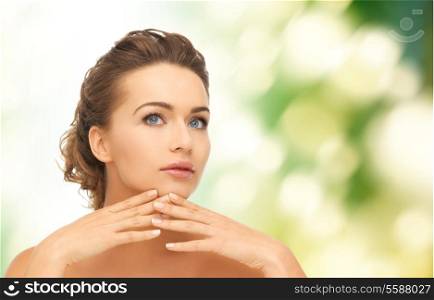 health and beauty concept - face and hands of beautiful woman with updo, can be used as a template for jewelry
