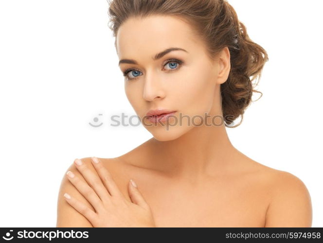 health and beauty concept - face and hands of beautiful woman with updo (can be used as a template for jewelry). beautiful woman with long hair