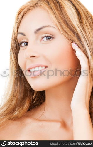 health and beauty concept - face and hands of happy woman with long hair