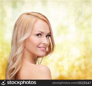 health and beauty concept - face and shoulders of happy woman with long hair