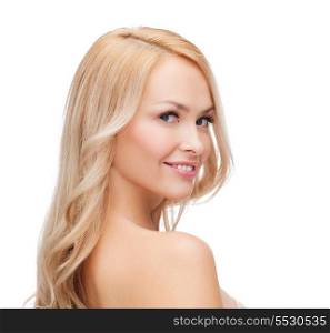 health and beauty concept - face and shoulders of happy woman with long hair