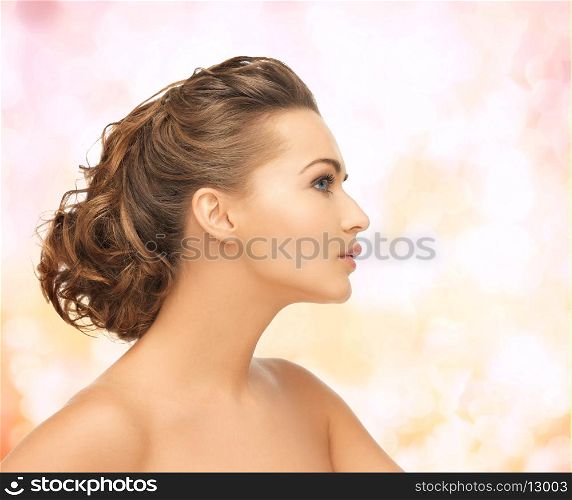 health and beauty concept - face of beautiful bride with evening updo