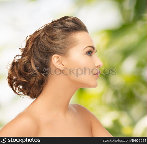 health and beauty concept - face of beautiful bride with evening updo