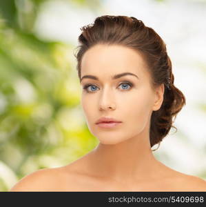 health and beauty concept - face of beautiful bride with evening updo