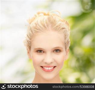 health and beauty concept - face of beautiful smiling teenage girl