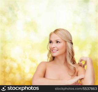 health and beauty concept - face of beautiful woman touching her shoulder skin