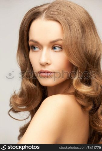 health and beauty concept - face of beautiful woman with long hair