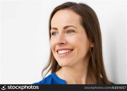 health and beauty concept - face of happy smiling middle aged woman. face of happy smiling middle aged woman. face of happy smiling middle aged woman