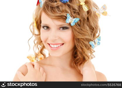 health and beauty concept - happy teenage girl with butterflies in hair