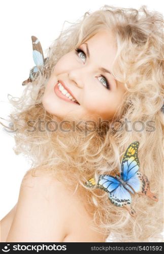 health and beauty concept - happy woman with butterflies in hair