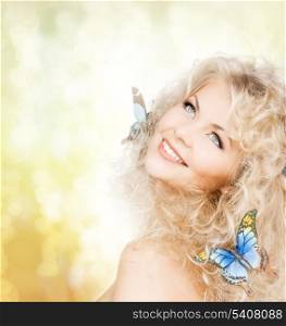 health and beauty concept - happy woman with butterflies in hair