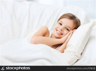 health and beauty concept - little girl sleeping at home