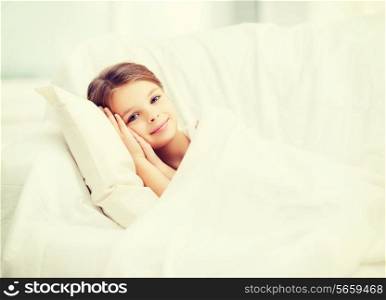 health and beauty concept - little girl sleeping at home