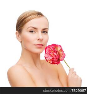 health and beauty concept - lovely woman with pink peony flower