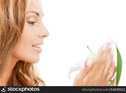 health and beauty concept - lovely woman with white lily flower