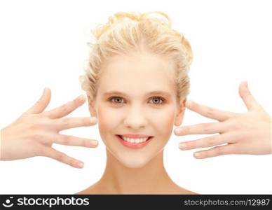 health and beauty concept - picture of beautiful teenage girl showing her hands