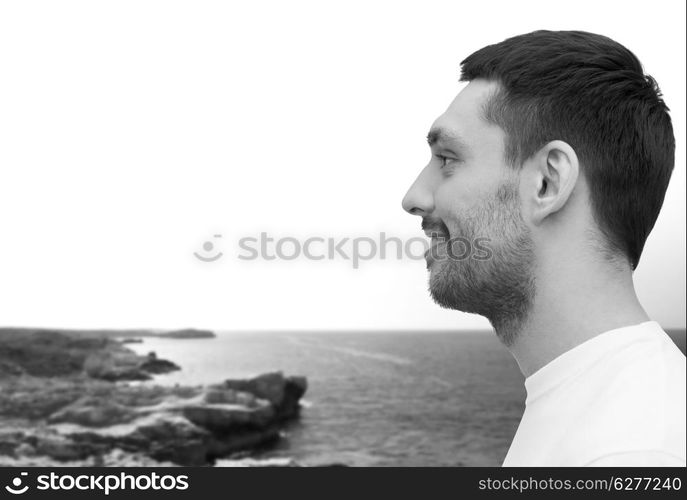 health and beauty concept - portrait of smiling young handsome man