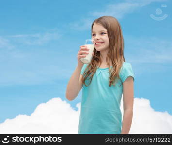 health and beauty concept - smiling little girl drinking milk out of glass