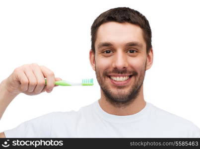 health and beauty concept - smiling young man with toothbrush