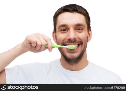 health and beauty concept - smiling young man with toothbrush