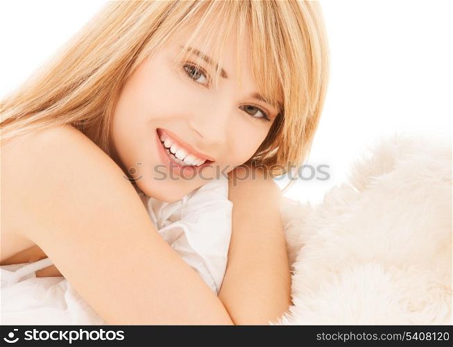 health and beauty concept - teenage girl in the bed at home