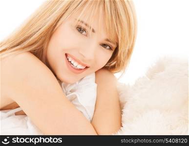 health and beauty concept - teenage girl in the bed at home