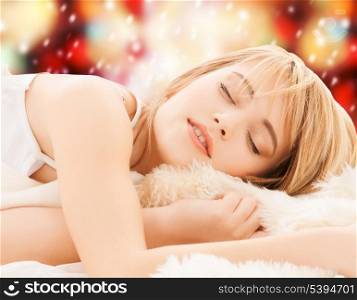 health and beauty concept - teenage girl sleeping at home