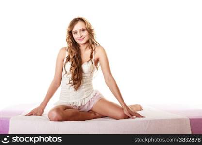 Health and beauty concept. Young lovely woman long curly hair relaxing on her bed at morning