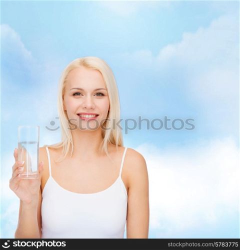 health and beauty concept - young smiling woman with glass of water