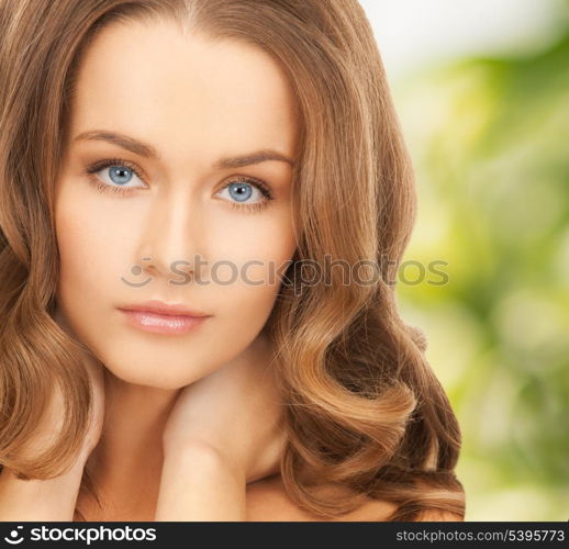 health and beauty, eco, bio, nature concept - face and hands of beautiful woman with long hair over green background