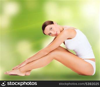 health and beauty, eco, bio, nature concept - sporty woman in cotton underwear doing exercises